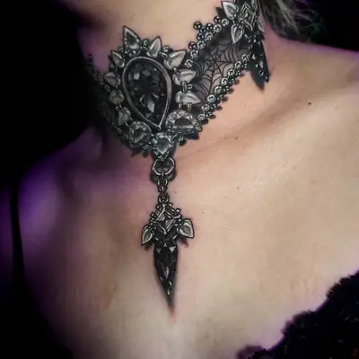 Ornate black lace choker tattoo on neck.