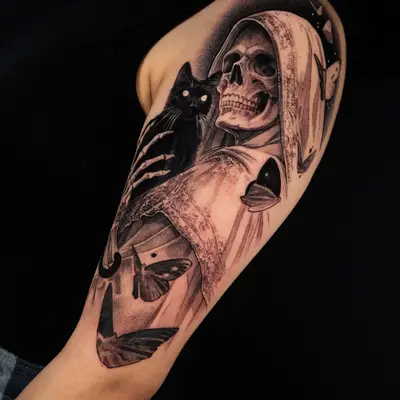 Tattoo of a hooded skeleton with a black cat and moths on arm.