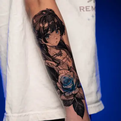 Tattoo of a girl with a blue rose on an inner forearm.