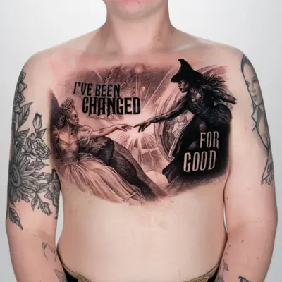 Chest tattoo featuring dramatic figures with text, showcasing a fantasy theme.