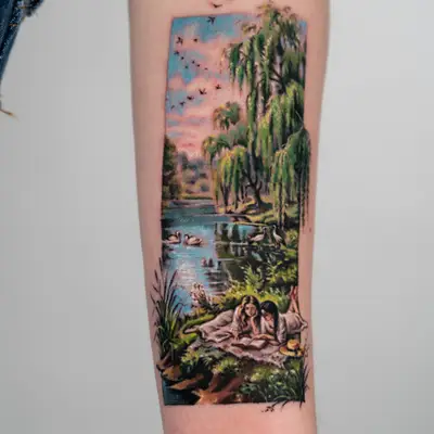 Tattoo of a peaceful lakeside scene with two women and swans.