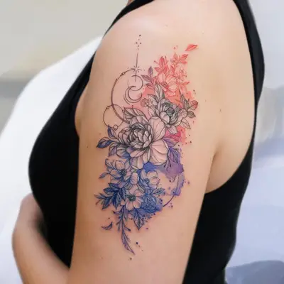Tattoo of flowers in watercolor style on woman's upper arm