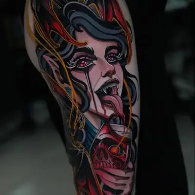 Neo-Traditional vampire woman tattoo with vibrant colors.