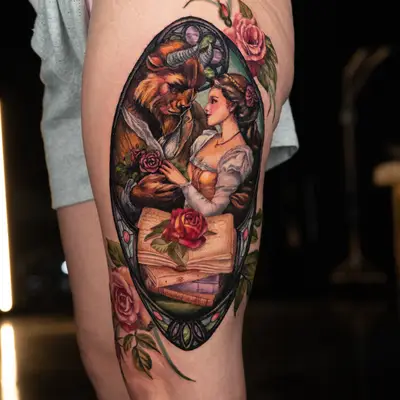 Tattoo of a Beauty and the Beast scene with roses.