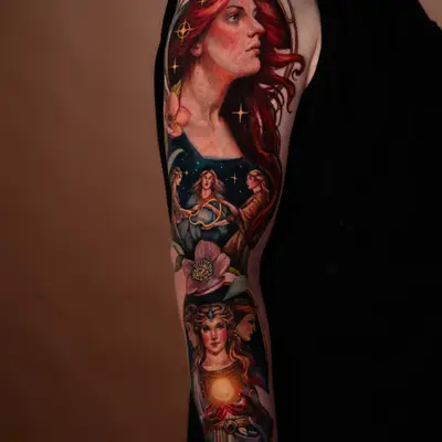 Colorful sleeve tattoo with mystical female figures and cosmic elements.