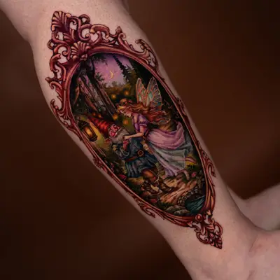 Color painterly tattoo of a gnome and a winged fairy dancing in a moonlit forest inside an ornate copper frame, on an outer calf.