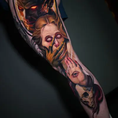 A striking tattoo featuring a demonic figure, a woman, and skulls on a leg.