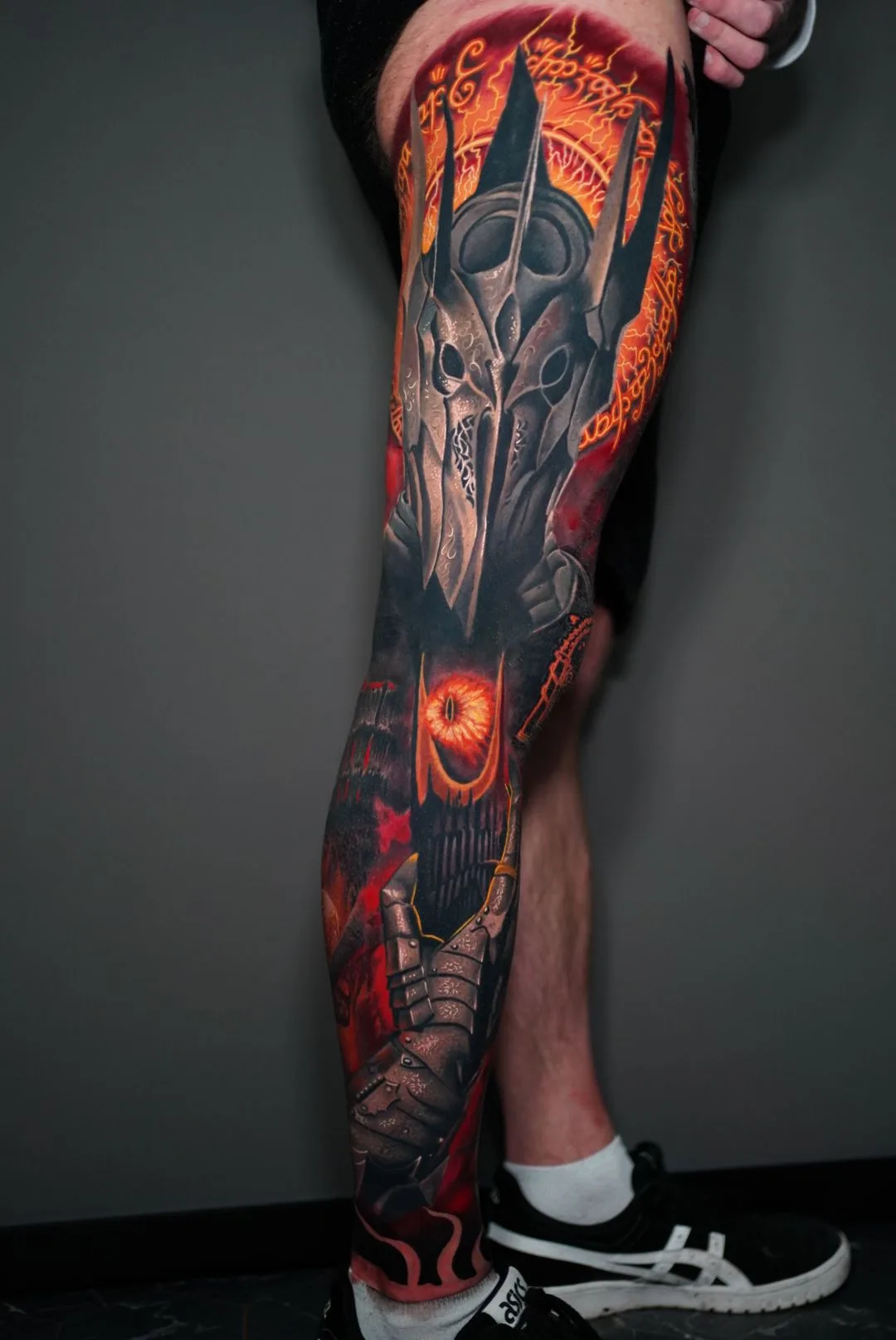 Detailed full leg tattoo featuring Sauron from Lord of the Rings and vibrant colors.