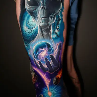Tattoo of an alien in a surrealism style holding an orb with a galaxy on an upper thigh.
