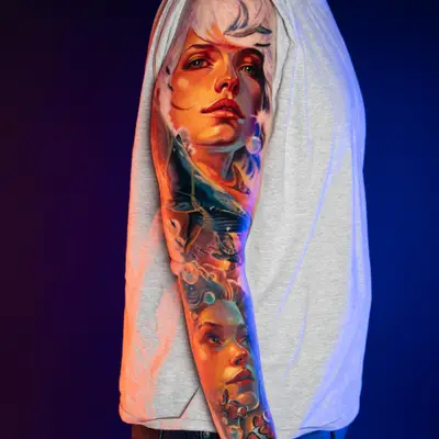 Colorful sleeve tattoo with portraits on arm