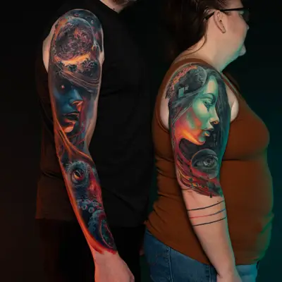 Colorful space-themed sleeve tattoos on two people's arms