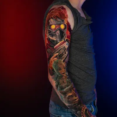 Full sleeve tattoo of Star-Lord, Groot, and Rocket from Guardians of the Galaxy in a color realism style. 