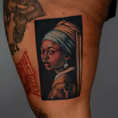 Tattoo of Girl With a Pearl Earring with melanated skin 