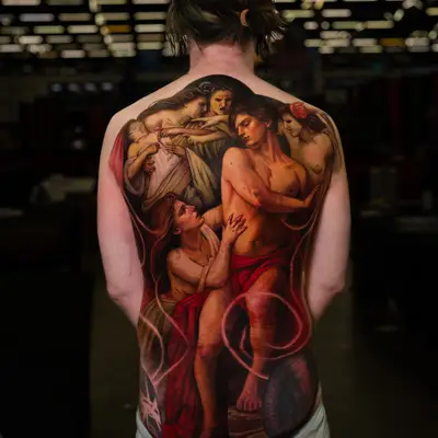 Intricate full back tattoo featuring classical figures in vibrant colors.
