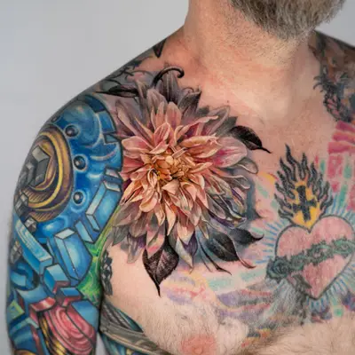 Colorful floral tattoo on shoulder with abstract designs on arm.
