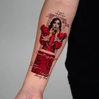 Portrait of Lady Gaga in a red dress on a forearm.