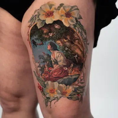 Painterly tattoo of a dreamy lady surrounded by forest animals and framed by flowers.