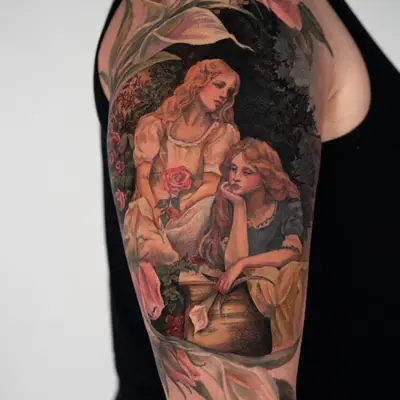 Painterly tattoo of two girls framed by rose and lily flowers.