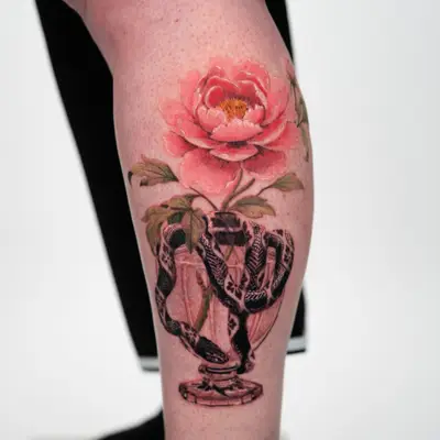 Peony coming out of a decorative vase with a snake wrapped around it.