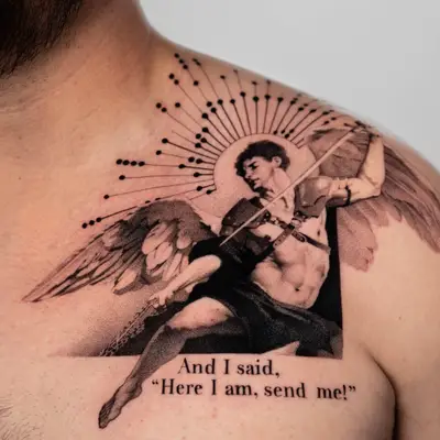 A detailed tattoo of an angel with wings on a man's chest.