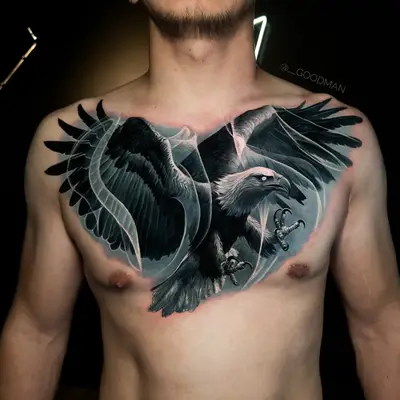 Chest tattoo depicting a detailed eagle with outstretched wings.