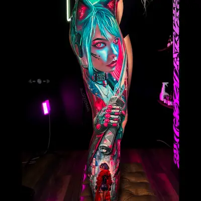 Vibrant neo-traditional cyberpunk sleeve tattoo on leg.