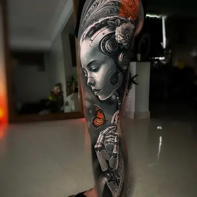 Realistic tattoo of a robotic woman with a butterfly on leg.