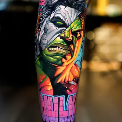 Colorful Hulk-themed tattoo on forearm