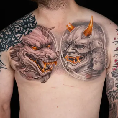Chest tattoo featuring a dragon and samurai mask in detailed realism with gold accents
