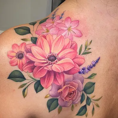 Colorful floral tattoo on shoulder with pink and purple flowers