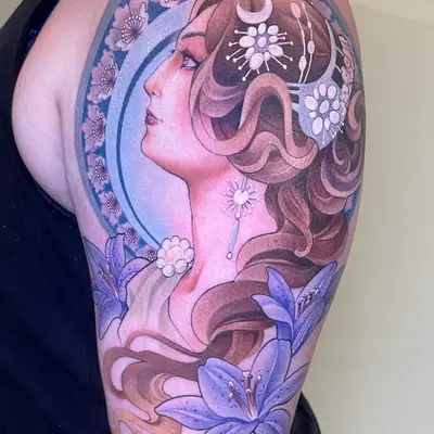 Tattoo of a woman's profile with flowers and crescent moon