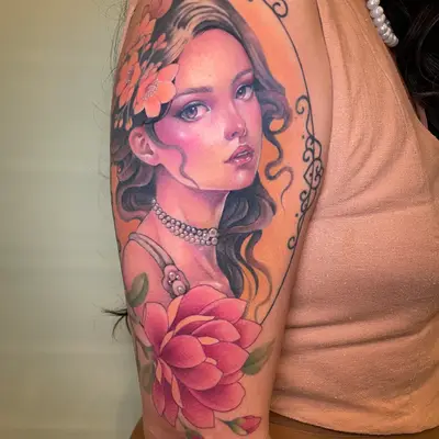 Tattoo of a woman with flowers on her arm.