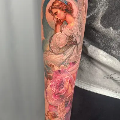 Tattoo of an angel and rose on forearm