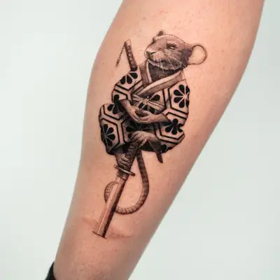 Tattoo of a samurai mouse on leg