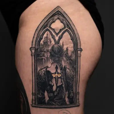 Tattoo of a figure in armor looking through a gothic window at a distant city.