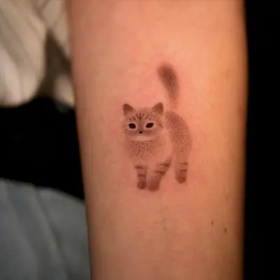 Dotwork cat tattoo on forearm