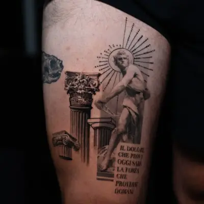 Tattoo of classical columns and statue with rays and Italian text on thigh.