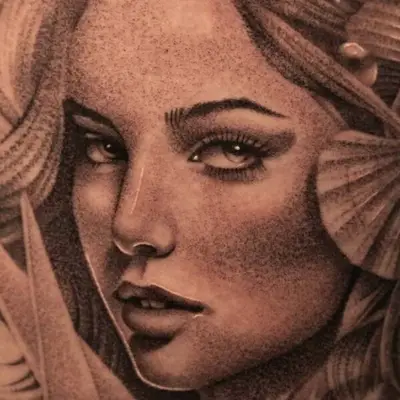 Black and grey tattoo of a woman's face with detailed shading.