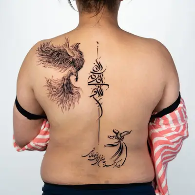 Back tattoo of a phoenix, Arabic script, and a whirling dervish.