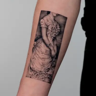 Tattoo of a vintage-dressed woman without visible face on forearm.