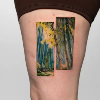 Tattoo of a colorful bamboo forest on thigh split into two sections.