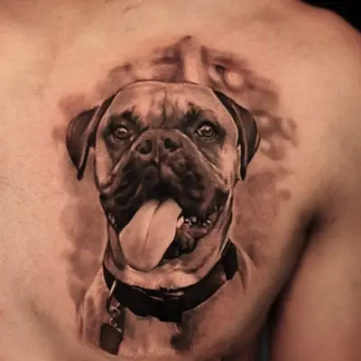 Realistic dog portrait tattoo on upper chest