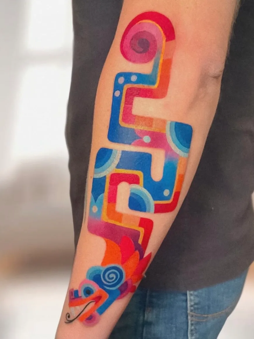 Colorful abstract tattoo on inner forearm