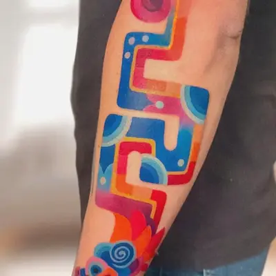Colorful abstract tattoo on inner forearm
