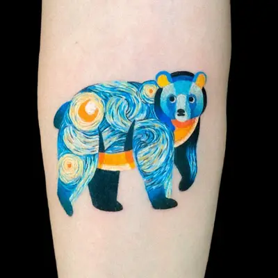 Colorful bear tattoo with swirling patterns on forearm