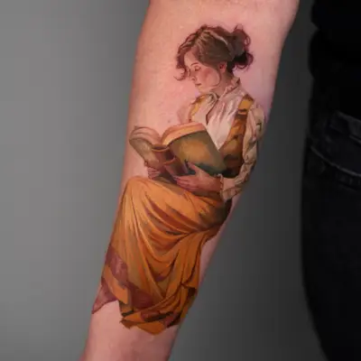 Tattoo of a woman in period clothing reading a book, placed on forearm.