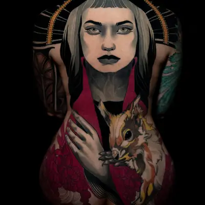 Full back tattoo of a woman with grey skin, dark lips and a blunt grey fringe under a black and gold beaded arch, wearing a red robe and holding a brown and orange squirrel at the waist, with deep red flowers across the hips.
