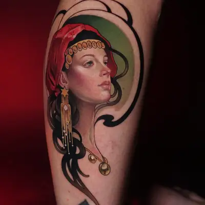 A detailed portrait tattoo of a woman with a red headscarf and jewelry.