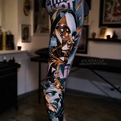 Abstract geometric portrait tattoo with control key elements on leg.