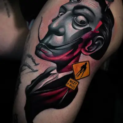 Stylized realistic portrait of Salvador Dali on a thigh.